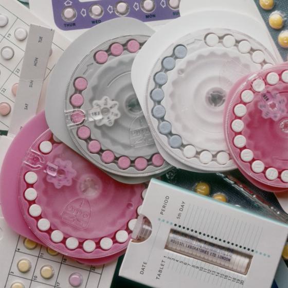 Various types of birth control pills on a table