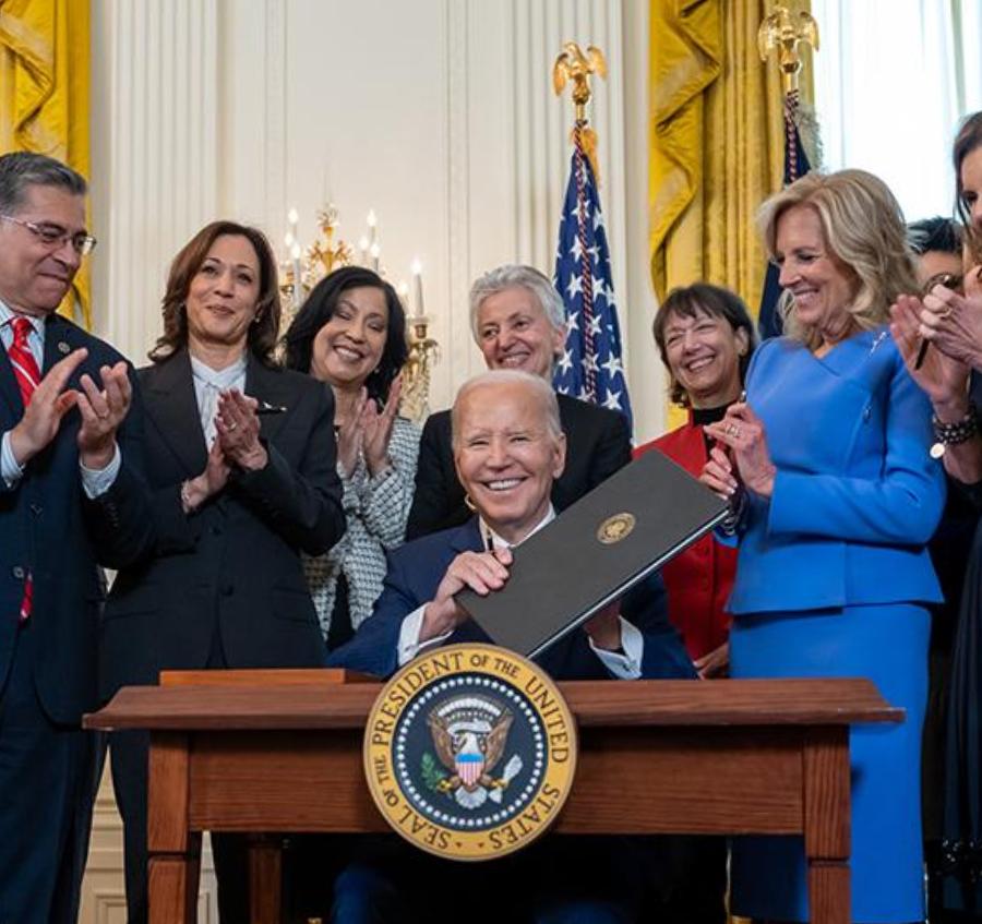 biden holding a folder