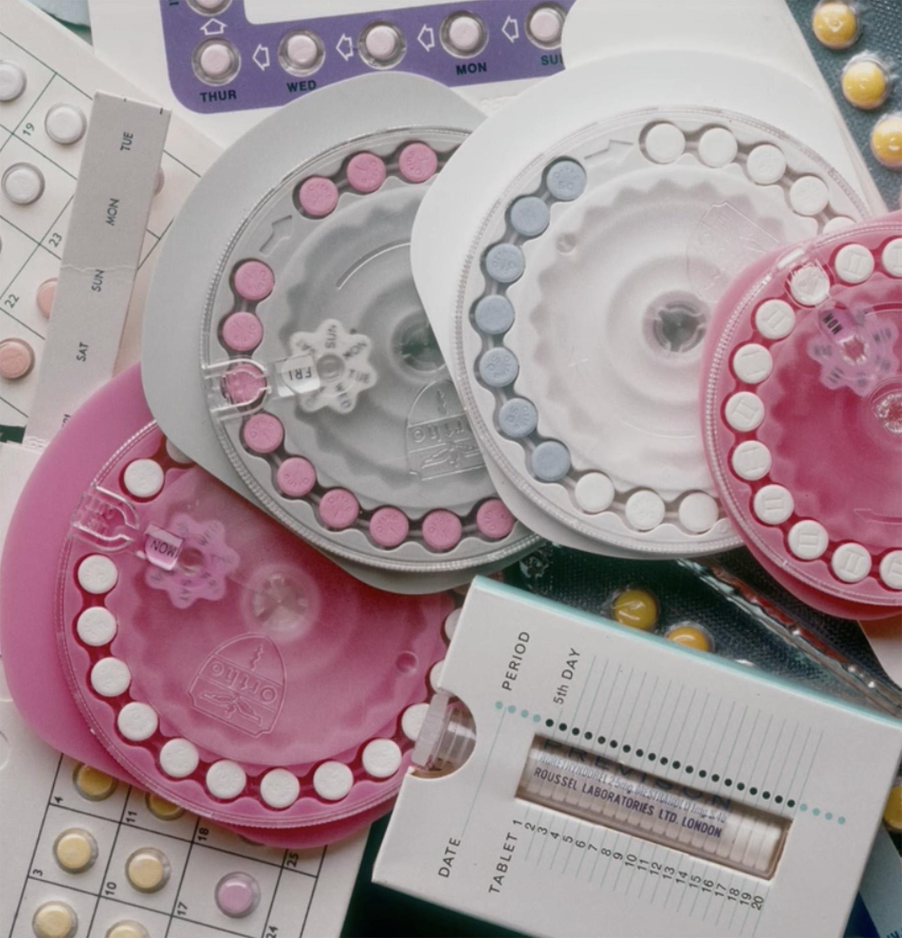 Various types of birth control pills on a table